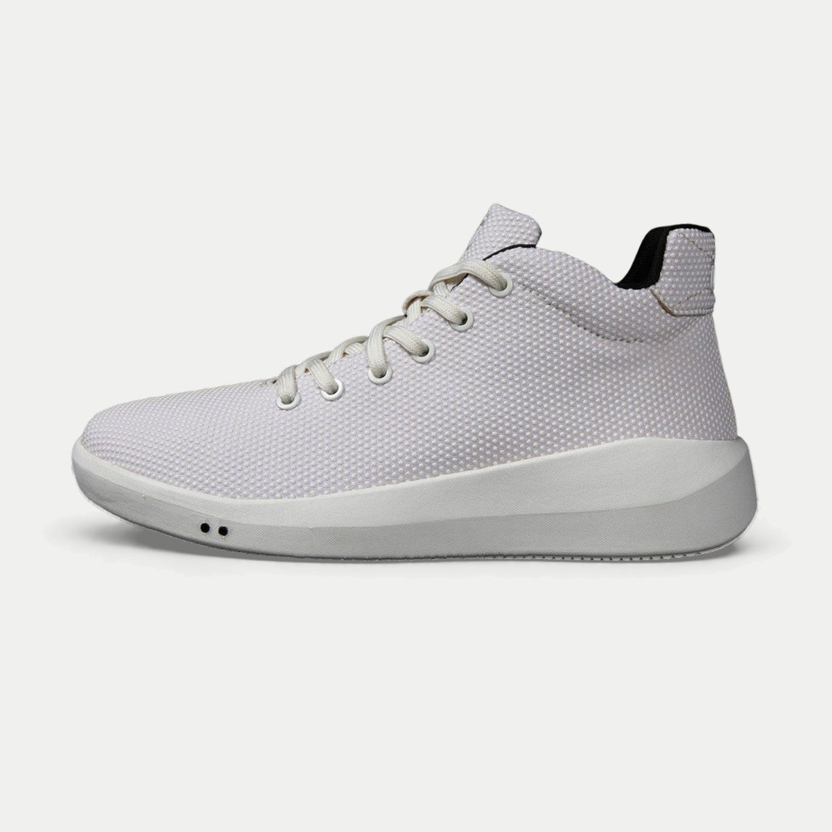 Perform Whiteout, Mid, three-quarter view on stone