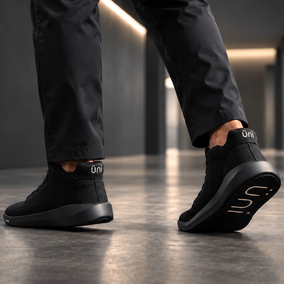 Walking in Perform Blackout Mid on a polished concrete floor, üni on the heels and the outsole